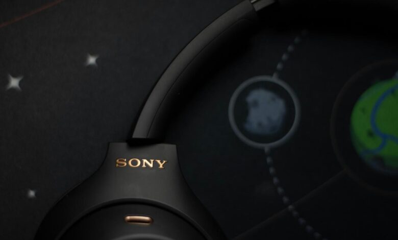 Black sony headphones on a starry background